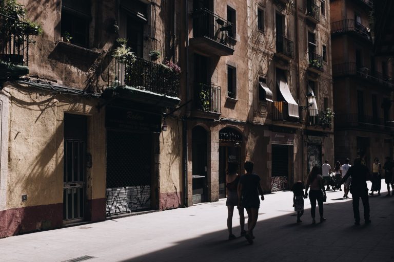 photo of people walking in the street