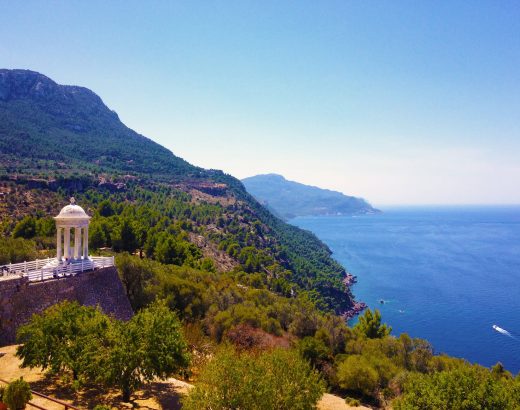 white dome terrace on brown cliff during daytime