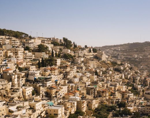 beige concrete buildings on high ground