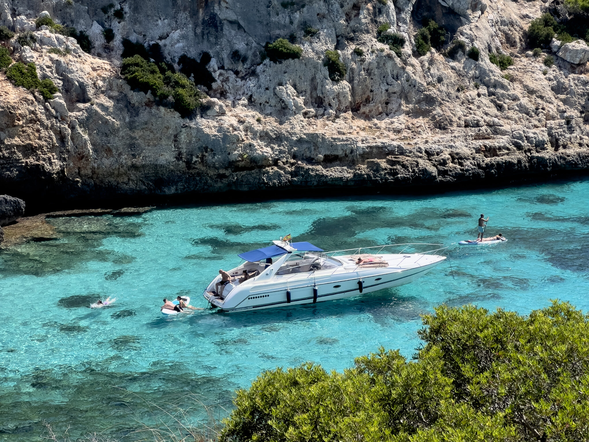 A boat floating on crystal clear water